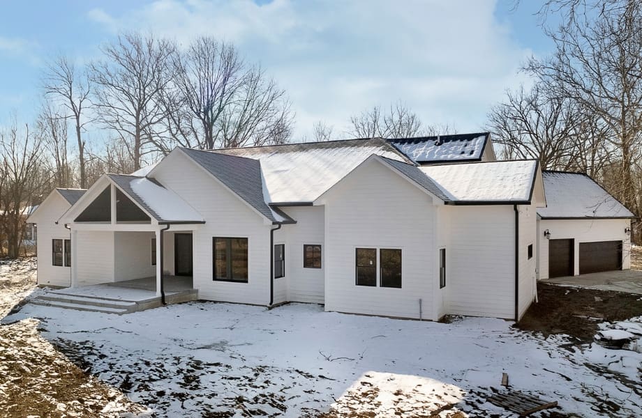 a house with snow on the ground winter home maintenance